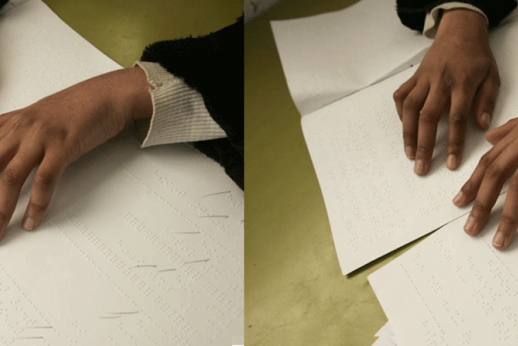 Hands reading braille